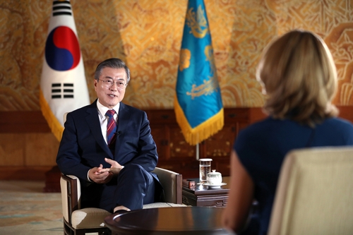 South Korean President Moon Jae-in (L) is interviewed by Britain's BBC news at his office Cheong Wa Dae in Seoul on Oct. 12, 2018, in this photo released by Cheong Wa Dae. (Yonhap)