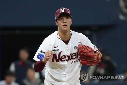 An Woo-jin of the Nexen Heroes celebrates after striking out Jamie Romak of the SK Wyverns in the top of the fifth inning of Game 4 of the second round playoff series in the Korea Baseball Organization at Gocheok Sky Dome in Seoul on Oct. 31, 2018. (Yonhap)