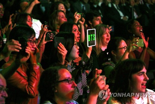 BTS fans cheer as the K-pop boy band takes the stage during a South Korea-France friendship concert in Paris on Oct. 14, 2018. (Yonhap)