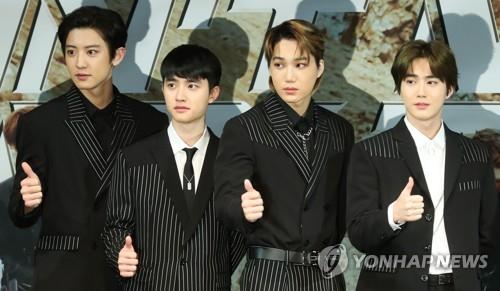 EXO members pose for photos during a press conference on Nov. 1, 2018 to announce the release of their new album "Don't Mess Up My Tempo." (Yonhap)