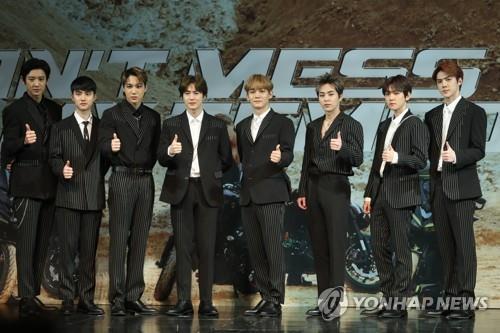 EXO members pose for photos during a press conference on Nov. 1, 2018, to announce the release of their new album "Don't Mess Up My Tempo." (Yonhap)