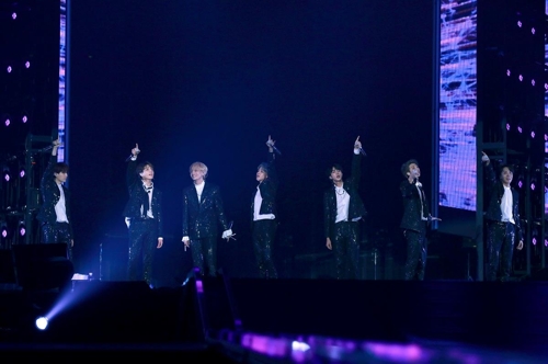This undated photo provided by Big Hit Entertainment shows the boy band BTS performing at the Tokyo Dome. (Yonhap)