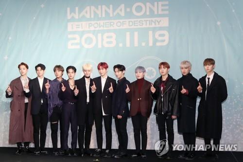 SEOUL, Nov. 20 (Yonhap) --The main track of K-pop boy band Wanna One's first studio album has swept local music streaming charts, data showed Tuesday. The song, "Spring Breeze," has topped seven local charts since the album was released at 6 p.m. Monday, outperforming two strong rivals -- Jennie's "Solo" and TWICE's "Yes or Yes." The new album, "1¹¹=1 (Power of Destiny)," is the group's first and probably last full-length album. The project boy group, comprised of 11 winners of music channel Mnet's idol competition show "Produce 101," started its group activities in August 2017 for a limited time, with its deadline set at the end of this year. The main track "Spring Breeze," with the hook's lyrics going, "Let's meet again when spring breeze blows past," is an alternative dance song with elements of synth-pop, guitar and dynamic percussion sounds. It is reported that their group activities might get a brief extension to earn time for year-end activities and a concert early next year. K-pop boy group Wanna One poses for photos during a press conference for its new album "1¹¹=1 (Power of Destiny)" in Seoul on Nov. 19, 2018. (Yonhap)