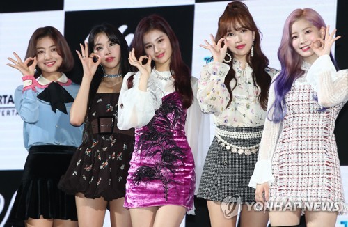 Members of TWICE pose for photos during a media showcase for the group's sixth EP, "Yes or Yes," at KBS Arena in western Seoul on Nov. 5, 2018. (Yonhap)