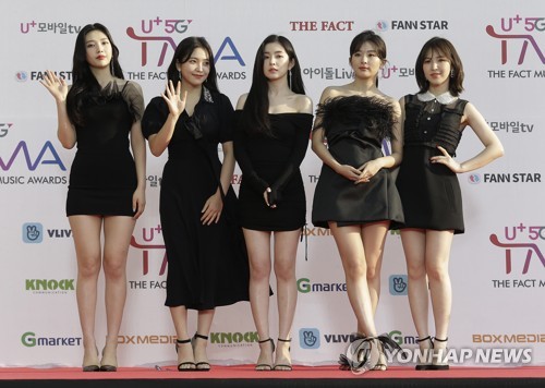 Members of South Korean K-Pop group Red Velvet pose for photos during The Fact Music Awards in Incheon, South Korea, (AP)