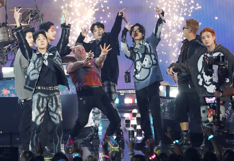 Coldplay and BTS perform during the 49th Annual American Music Awards at Microsoft Theatre in Los Angeles, California, U.S., November 21, 2021. Picture taken November 21, 2021. REUTERS/Mario Anzuoni