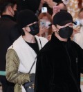Jungkuk (R) and Jimin, members of BTS, arrive at Incheon International Airport, west of Seoul, on Dec. 6, 2021, from a trip to the United States for the septet's concerts at SoFi Stadium in Los Angeles. (Yonhap)