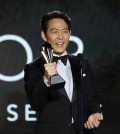 Lee Jung-Jae accepts the award for Best Actor in a Drama Series for "Squid Game" at the 27th annual Critics Choice Awards in Los Angeles on Sunday, March 13, 2022. [reuters]