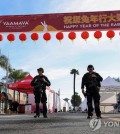 Police officers guard the area near the location of a shooting that took place during a Chinese Lunar New Year celebration in Monterey Park, California, the United States, on Jan. 22, 2023, in this Reuters photo. (Yonhap)