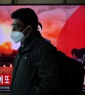 A man walks past a TV broadcasting a news report on North Korea firing two ballistic missiles off its east coast, in Seoul, South Korea, February 20, 2023. REUTERS/Kim Hong-Ji