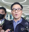 Cho Hyun-chun (C), a former head of the now-defunct Defense Security Command, speaks to reporters at Incheon International Airport, west of Seoul, on March 29, 2023. (Yonhap)