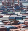 In this file photo, containers for export are stacked at a pier in South Korea's largest port city of Busan, 320 kilometers south of Seoul, on May 10, 2023. (Yonhap)