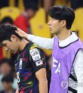 Son Heung-min of South Korea (R) consoles teammate Lee Kang-in following the team's 1-0 loss to Peru in their friendly football match at Busan Asiad Main Stadium in Busan, 320 kilometers southeast of Seoul, on June 16, 2023. (Yonhap)