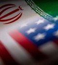 FILE PHOTO: Iran's and U.S.' flags are seen printed on paper in this illustration taken January 27, 2022. REUTERS/Dado Ruvic/Illustration//File Photo