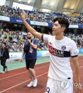 His stay in his home country might only have been for a couple of days, but Paris Saint-Germain's new South Korean midfielder Lee Kang-in said Thursday he is taking plenty of fond memories with him. Lee came off the bench in the 69th minute in PSG's preseason friendly against the K League 1 side Jeonbuk Hyundai Motors at Busan Asiad Main Stadium in the southeastern city of Busan. Lee didn't factor into scoring in PSG's 3-0 win, but he was still the favorite of 43,520 fans on hand. Lee Kang-in of Paris Saint-Germain acknowledges fans at Busan Asiad Main Stadium in the southeastern city of Busan after a 3-0 win over Jeonbuk Hyundai Motors in their friendly match on Aug. 3, 2023. (Yonhap) Lee Kang-in of Paris Saint-Germain acknowledges fans at Busan Asiad Main Stadium in the southeastern city of Busan after a 3-0 win over Jeonbuk Hyundai Motors in their friendly match on Aug. 3, 2023. (Yonhap) "I had such a great time playing here, and my teammates also enjoyed their stay in Korea," Lee said in a televised interview afterward. "Hopefully, we will have more of these in the future." Lee had missed PSG's three preseason matches in Japan before arriving in South Korea on Wednesday, as he was nursing a thigh injury suffered in a late July exhibition in France. Lee said he's slowly working his back into form. "I am pain free, but there are still concerns about reinjury," Lee said. "I am trying to take care of it the best I can." Lee had spent his entire club career in Spain before joining PSG in July, with global stars like Neymar and Kylian Mbappe as his teammates. "We have so many great players here, and we hit it off from my first day," Lee said. "I think I should be able to play even better down the road." Lee Kang-in of Paris Saint-Germain acknowledges fans at Busan Asiad Main Stadium in the southeastern city of Busan after a 3-0 win over Jeonbuk Hyundai Motors in their friendly match on Aug. 3, 2023. (Yonhap) Lee Kang-in of Paris Saint-Germain acknowledges fans at Busan Asiad Main Stadium in the southeastern city of Busan after a 3-0 win over Jeonbuk Hyundai Motors in their friendly match on Aug. 3, 2023. (Yonhap) The skilled midfielder is one of the most popular football players in South Korea. The 22-year-old said he wants to make his country proud. "I will do my best in every moment, the way I've been doing all along," he said. "I want to show people that South Korean football has improved and the country has a lot of great players." After the interview, Lee circled the stadium to acknowledge fans, before joining the rest of his team for a flight back to France. This was PSG's final preseason match. Their Ligue 1 season will kick off on Aug. 12. PSG have won a league-record 11 titles, nine of which have come since the 2012-23 season. Lee Kang-in of Paris Saint-Germain dribbles the ball against Jeonbuk Hyundai Motors during their friendly match at Busan Asiad Main Stadium in the southeastern city of Busan on Aug. 3, 2023. (Yonhap) Lee Kang-in of Paris Saint-Germain dribbles the ball against Jeonbuk Hyundai Motors during their friendly match at Busan Asiad Main Stadium in the southeastern city of Busan on Aug. 3, 2023. (Yonhap)