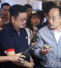 Finance Minister Choo Kyung-ho (R) speaks to a shop owner at a fish market in Seoul on Sept. 20, 2023. (Yonhap)