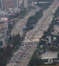 This photo, taken aboard a police helicopter, shows an aerial view of a road junction clogged with heavy traffic in Yongin, just south of Seoul, on Sept. 27, 2023, as people headed to their hometowns to celebrate the extended Chuseok holiday. (Yonhap)