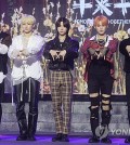K-pop boy group Tomorrow X Together poses for photos during a media showcase held in Seoul on Oct. 12, 2023, for its upcoming third full-length album, "The Name Chapter: Freefall." The album is set to come out Oct. 13. (Yonhap)