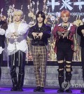 K-pop boy group Tomorrow X Together poses for photos during a media showcase held in Seoul on Oct. 12, 2023, for its upcoming third full-length album, "The Name Chapter: Freefall." The album is set to come out Oct. 13. (Yonhap)