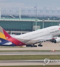 This file photo from June 7, 2023, shows an Asiana Airlines plane taking off from Incheon International Airport, west of Seoul. (Yonhap)