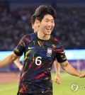 His goal helped send South Korea into the semifinals of the men's football tournament at the Asian Games in China on Sunday night, but South Korean winger Song Min-kyu was not in the mood to celebrate anything just yet. "It's a relief to get this win, but I don't know if I am 100 percent happy right now," Song said following South Korea's 2-0 win over China in the quarterfinals at Huanglong Sports Centre Stadium in Hangzhou. "We've only made it to the semifinals, and we have two more steps that we want to take. We'll only enjoy this tonight and get back to work tomorrow." Song Min-kyu of South Korea (C) celebrates after scoring against China during the teams' quarterfinals match in the men's football tournament at the Asian Games at Huanglong Sports Centre Stadium in Hangzhou, China, on Oct. 1, 2023. (Yonhap) Song Min-kyu of South Korea (C) celebrates after scoring against China during the teams' quarterfinals match in the men's football tournament at the Asian Games at Huanglong Sports Centre Stadium in Hangzhou, China, on Oct. 1, 2023. (Yonhap) Song was referring to the two more wins that South Korea need to win their third consecutive gold in men's football. Song scored in the 35th minute after making his first start of the tournament but said he is never fully satisfied. "I know I could have been better in some areas and made mistakes where I shouldn't have," he said. "I know I have my work cut out to keep growing." South Korea will next play Uzbekistan in the semifinals Wednesday. "I think they will be an extremely difficult opponent, but they will probably see us the same way," Song said. "Regardless of the opponents, we absolutely want to win every match." Midfielder Hong Hyun-seok, who opened the scoring in the 18th minute, said he got a kick out of silencing the loud, pro-Chinese crowd with his free kick goal. "This place felt a little like a library at that moment," Hong said. "When we went out for the warmup, I was surprised to see so many people in the stands that early. But once we started the match, I didn't really pay attention to them." Hong said he has enjoyed being on such a tight-knit team. "I absolutely love this team," he said. "Everyone is working so hard toward the same goal, and we are a really close group. That chemistry carried us in this match." Hong Hyun-seok of South Korea celebrates after scoring against China during the teams' quarterfinals match in the men's football tournament at the Asian Games at Huanglong Sports Centre Stadium in Hangzhou, China, on Oct. 1, 2023. (Yonhap) Hong Hyun-seok of South Korea celebrates after scoring against China during the teams' quarterfinals match in the men's football tournament at the Asian Games at Huanglong Sports Centre Stadium in Hangzhou, China, on Oct. 1, 2023. (Yonhap)
