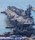 The USS Ronald Reagan aircraft carrier docks at a naval base in the southeastern port city of Busan on Oct. 12, 2023, in this photo provided by Yonhap News TV. (PHOTO NOT FOR SALE) (Yonhap)
