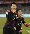 Soccer Football - World Cup - AFC Qualifiers - Group C - China v Republic of Korea - Shenzhen Universiade Sports Centre, Shenzhen, China - November 21, 2023 Republic of Korea's Son Heung-Min celebrates scoring their first goal with Hwang Hee-Chan REUTERS/Tingshu Wang