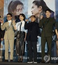 The director and cast of "Alienoid 2" pose for photos during a press conference to promote the film in Seoul on Nov. 22, 2023. (Yonhap)