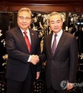 Foreign Minister Park Jin (L) shakes hands with Chinese Foreign Minister Wang Yi ahead of their bilateral talks at the Shangri-La hotel in Jakarta, Indonesia, on July 14, 2023, in this file photo provided by Park's office. (PHOTO NOT FOR SALE) (Yonhap)