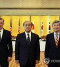 National Security Adviser Cho Tae-yong (R), U.S. National Security Adviser Jake Sullivan (L) and Japan's National Security Secretariat Secretary General Takeo Akiba pose for a photo at their meeting in Tokyo on June 15, 2023, in this file photo provided by the presidential office. (PHOTO NOT FOR SALE) (Yonhap)
