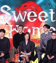 Cast members and director Lee Eung-bok (far R, front row) of "Sweet Home 2" attend a media event in Seoul on Nov. 30, 2023, one day before the series' premiere on Netflix. (Yonhap)