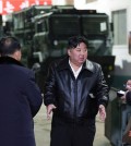 North Korean leader Kim Jong-un (C) talks to officials while inspecting a major munitions factory, in this photo released by the Korean Central News Agency on Jan. 10, 2024.