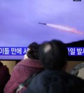 People watch a TV broadcasting a news report on North Korea firing multiple unidentified cruise missiles into the sea off its west coast, at a railway station in Seoul, South Korea, January 30, 2024. REUTERS/Kim Hong-Ji