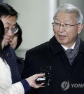Former Supreme Court Chief Justice Yang Sung-tae (R) answers reporters' questions as he leaves the Seoul Central District Court in southern Seoul on Jan. 26, 2024, after being acquitted of all 47 charges in a power abuse scandal. (Pool photo) (Yonhap)