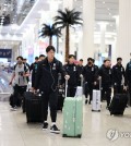 Members of the South Korean men's national football team walk through the concourse at Dubai International Airport on Jan. 3, 2024, to begin preparation for the Asian Football Confederation Asian Cup, in this photo provided by the Korea Football Association. (PHOTO NOT FOR SALE) (Yonhap)