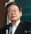 Lee Jae-myung, leader of the main opposition Democratic Party, speaks to reporters on Jan. 10, 2024, as he is discharged from the hospital following a stabbing attack in the southeastern port city of Busan. (Yonhap)