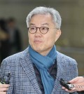 Choi Kang-wook, a former Democratic Party lawmaker, speaks to reporters ahead of a court ruling on Jan. 17, 2024. (Yonhap)