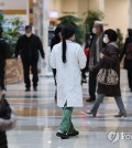 A medical staff member walks at a hospital in Seoul on Feb. 8, 2024. (Yonhap)