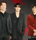 Actors Lee Hee-joon (L), Choi Woo-shik (C) and Son Suk-ku pose for photos at a press event for Netflix's upcoming original series "A Killer Paradox" in Seoul on Feb. 1, 2024. (Yonhap)