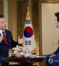 President Yoon Suk Yeol (L) speaks during a special interview with state-run broadcaster KBS at the presidential office in Seoul on Feb. 4, 2024, in this photo provided by the office. (PHOTO NOT FOR SALE) (Yonhap)