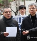 Park Myung-ha (L), who heads organizational affairs at the Korea Medical Association (KMA), and Kim Taek-woo, the head of the KMA's emergency committee, speak to reporters before being questioned by the police in Seoul on March 12, 2024. (Yonhap)
