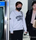 In this file photo, Olympic fencing medalist Nam Hyun-hee (L) leaves Songpa Police Station in Seoul after questioning over alleged collusion in fraud by her former fiance on Nov. 7, 2023. (Yonhap)