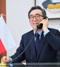 This photo, provided by South Korea's foreign ministry, shows Minister Cho Tae-yul speaking by phone with his Polish counterpart, Radoslaw Sikorski, on March 15, 2024. (PHOTO NOT FOR SALE) (Yonhap)