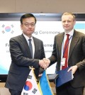 South Korean Finance Minister Choi Sang-mok (L) shakes hands with his Ukraine counterpart, Sergii Marchenko, after signing an agreement on low-interest loan programs for Ukraine in Washington on April 19, 2024, in this photo provided by South Korea's finance ministry. (PHOTO NOT FOR SALE) (Yonhap)