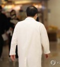 A medical worker walks in a hall at a hospital in Seoul on March 29, 2024. (Yonhap)