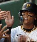 May 21, 2024; Pittsburgh, Pennsylvania, USA; Pittsburgh Pirates center fielder Ji Hwan Bae (3) high-fives in the dugout after scoring a run against the San Francisco Giants during the fifth inning at PNC Park. Mandatory Credit: Charles LeClaire-USA TODAY Sports