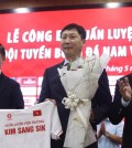 South Korean tactician Kim Sang-sik (C) poses for a photo during a press conference in Hanoi on May 6, 2024, marking his appointment as the new head coach of the Vietnamese men's senior and under-23 national football teams, in this photo provided by DJ Entertainment. (PHOTO NOT FOR SALE) (Yonhap)