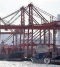 Shipping containers are stacked at a port in the southeastern city of Busan, in this file photo taken Feb. 13, 2024. (Yonhap)