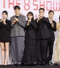 The cast of the new Netflix series "The 8 Show" poses for photographers during a press conference to promote the show at a Seoul hotel on May 10, 2024. (Yonhap)
