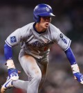 May 4, 2025; Atlanta, Georgia, USA; Los Angeles Dodgers second baseman Hyeseong Kim (6) slides into third base against the Atlanta Braves in the ninth inning at Truist Park. Mandatory Credit: Brett Davis-Imagn Images